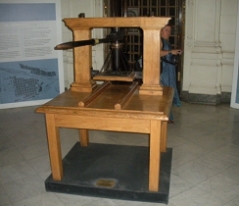 Figure 1b. Vintage printing press (1812) at the National Library of Chile. Photo by J. Krueger. Figure 1b. Vintage printing press (1812) at the National Library of Chile. Photo by J. Krueger.